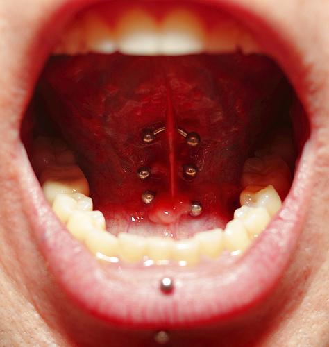 Vertical Labret And Tongue Frenulum Piercing