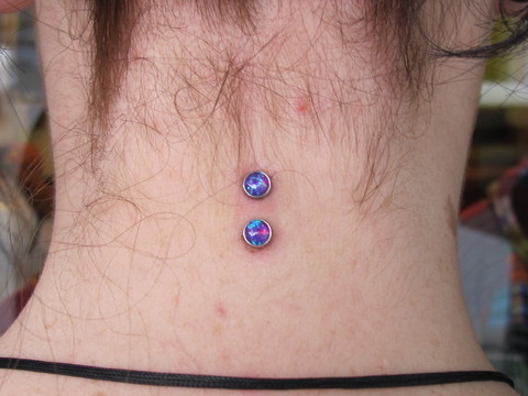 Vertical Surface Neck Piercing With Colored Opal Microdermals