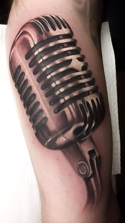 Vintage microphone tattoo on arm by Levi Barnett