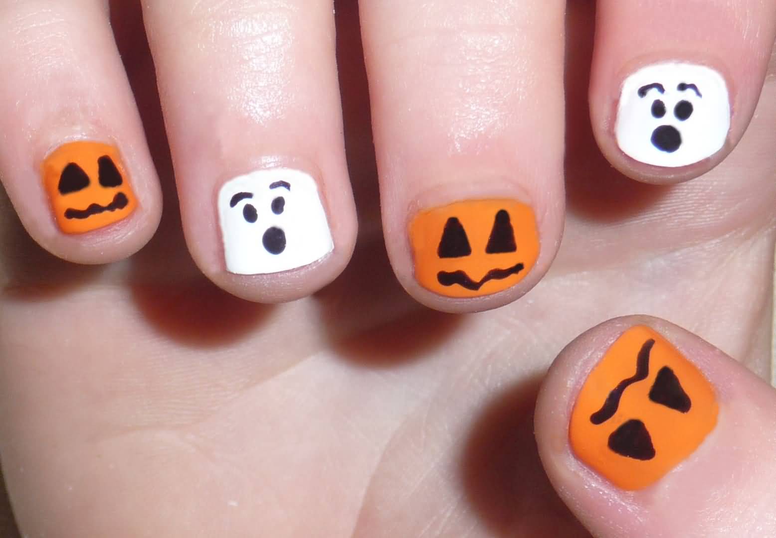 White And Orange Matte Scary Faces Nail Art
