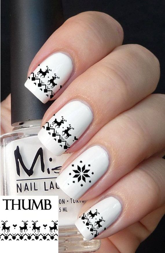 White Nails With Black Reindeer Sweater Design Christmas Nail Art