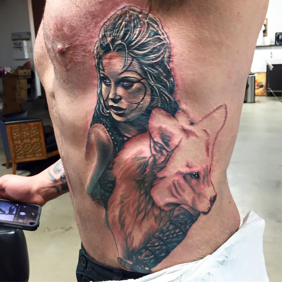 Wolf warrior tattoo on siderib by Matti Hixson