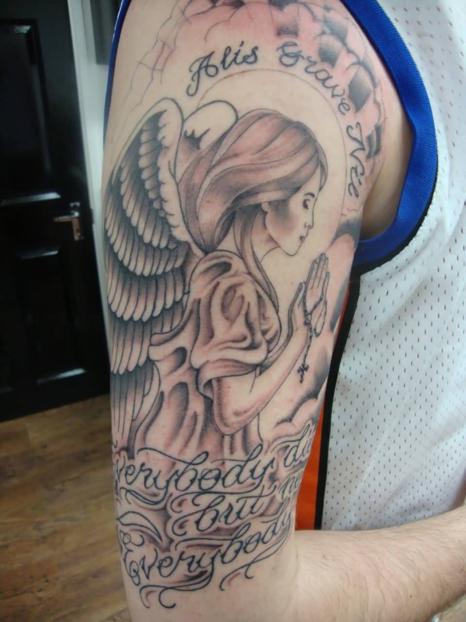Wonderful Praying Angel With Lettering Tattoo On Right Half Sleeve