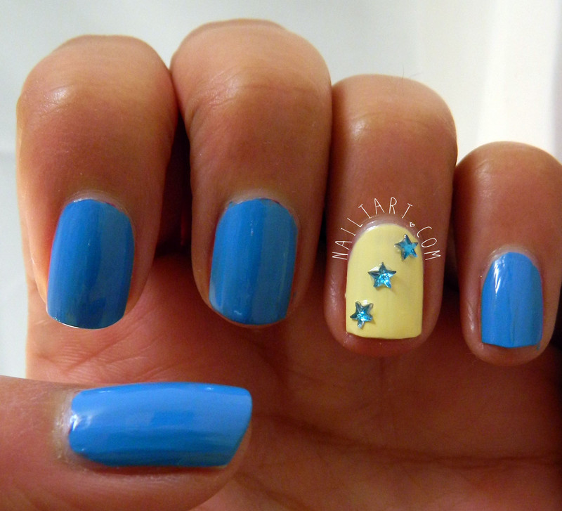 Yellow Accent Nail With Blue 3D Stars Design Nail Art