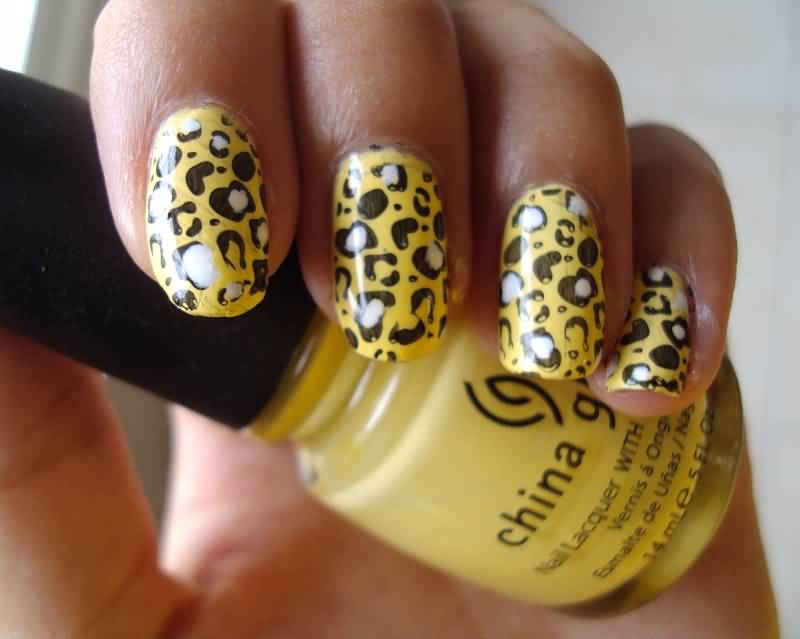 Yellow Base Nails With Black And White Leopard Print Nail Art