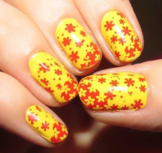 Yellow Base Nails With Orange Flowers Nail Art