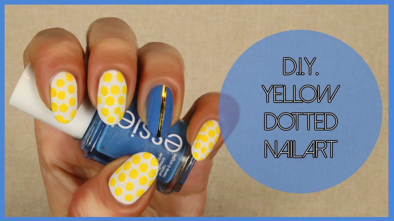 Yellow Dotted And Accent Blue Nail Art
