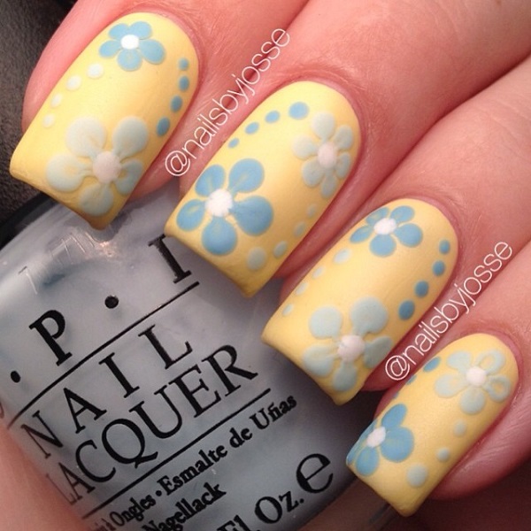 Yellow Matte Nails With Blue Acrylic Flowers Nail Art