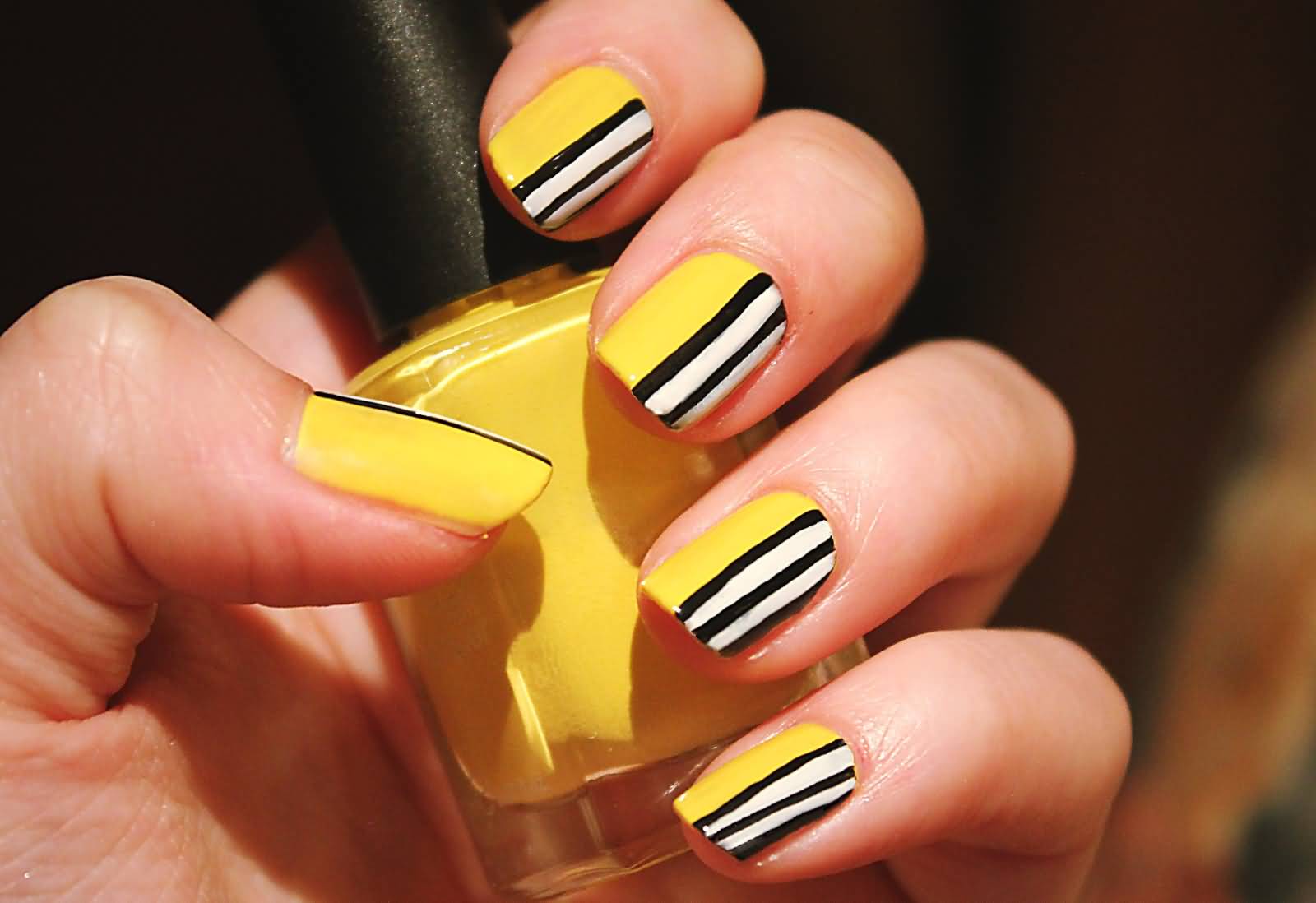 Yellow Nails With Black And White Stripes Design Nail Art