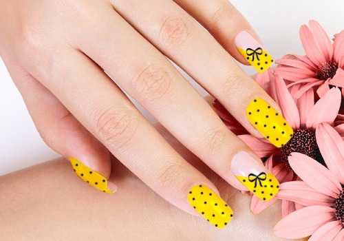 Yellow Nails With Black Dots And Black Bow Design Idea