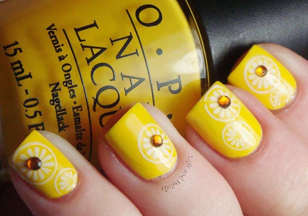 Yellow Nails With White Flowers And Rhinestones Design