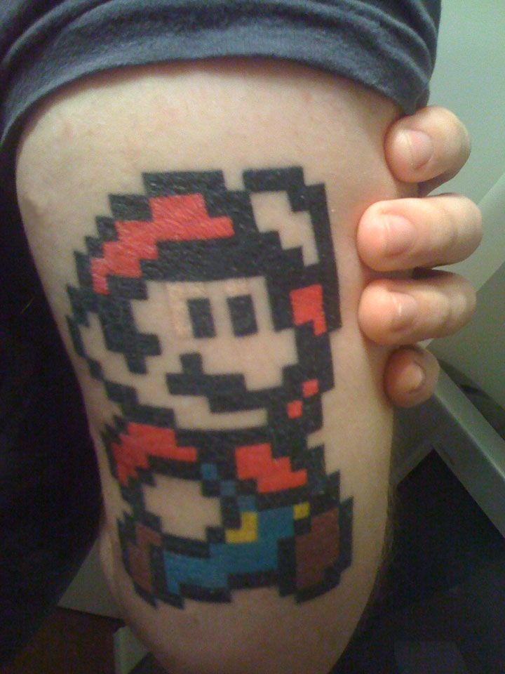 8 Bit Mario Tattoo On Triceps