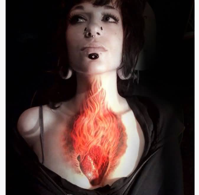 Awesome Burning Heart Flame Tattoo On Girl Chest