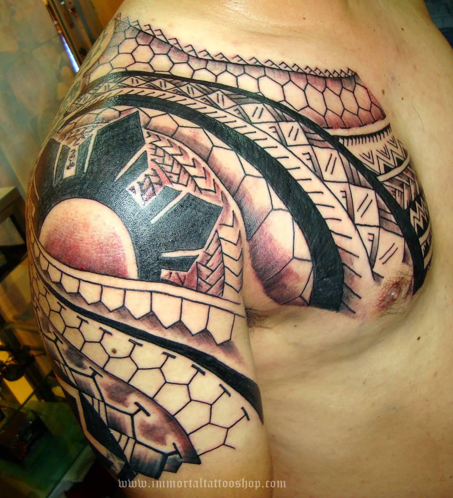 Awesome Filipino Tribal Tattoo On Man Chest And Shoulder