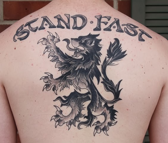 Awesome Grey Scottish Tattoo On Upper Back