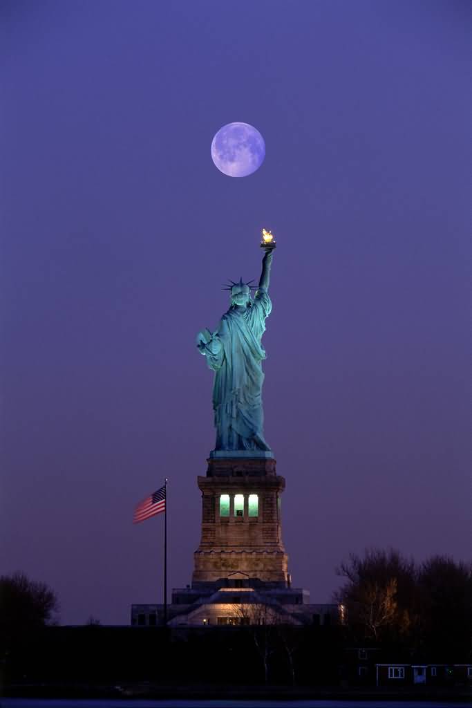 Back View Of Statue Of Liberty With Full Moon