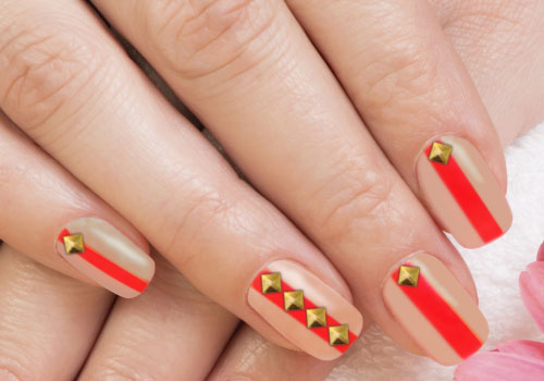 Beige Matte With Orange Stripes And Gold Studs Design Nail Art