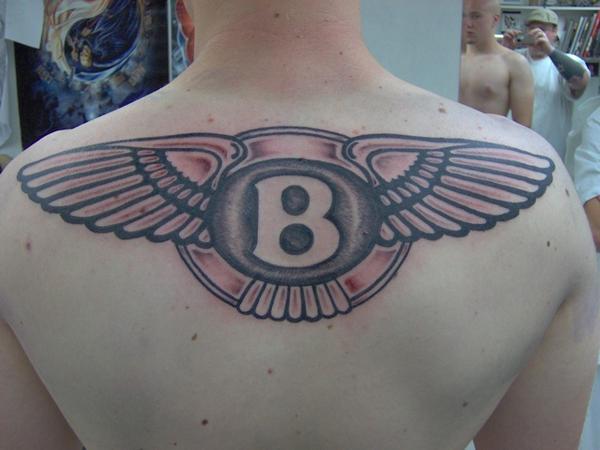 Bentley Logo Tattoo On Upper Back For Men