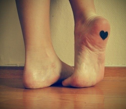 Black Heart Tattoo On Sole Of Foot