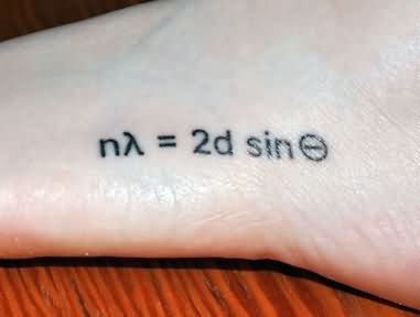 Black Ink Braggs Law Physics Tattoo On Foot