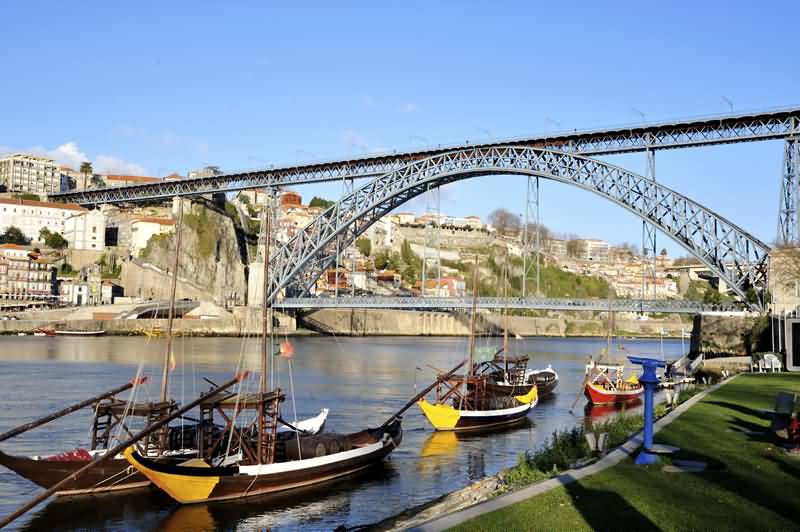 Boats In Douro River Near Dom Luis Bridge
