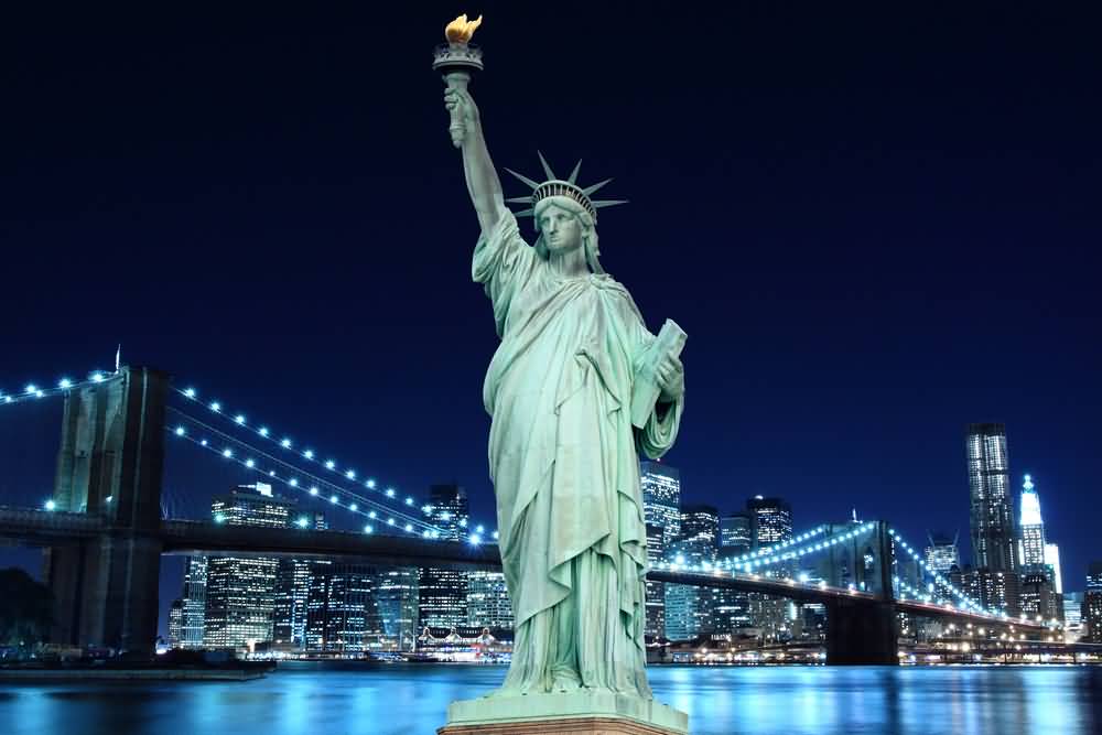 Brooklyn Bridge And Statue Of Liberty At Night