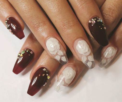 Brown Nails Art With White Flowers And Rhinestones Design