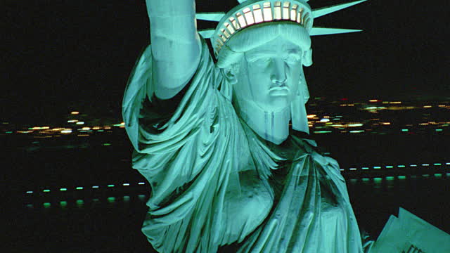 Closeup Of Statue Of Liberty Face Lit Up At Night