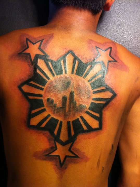 Cool Filipino Sun With Stars Tattoo On Upper Back