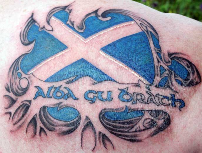 Cool Ripped Skin Scottish Flag Tattoo