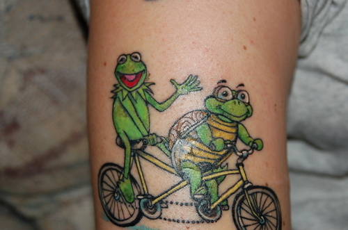 Cute Frog And Turtle Cycling Tattoo On Arm