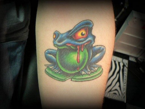 Evil Frog Tattoo On Forearm