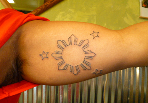 Filipino Sun And Stars Tattoo On Biceps