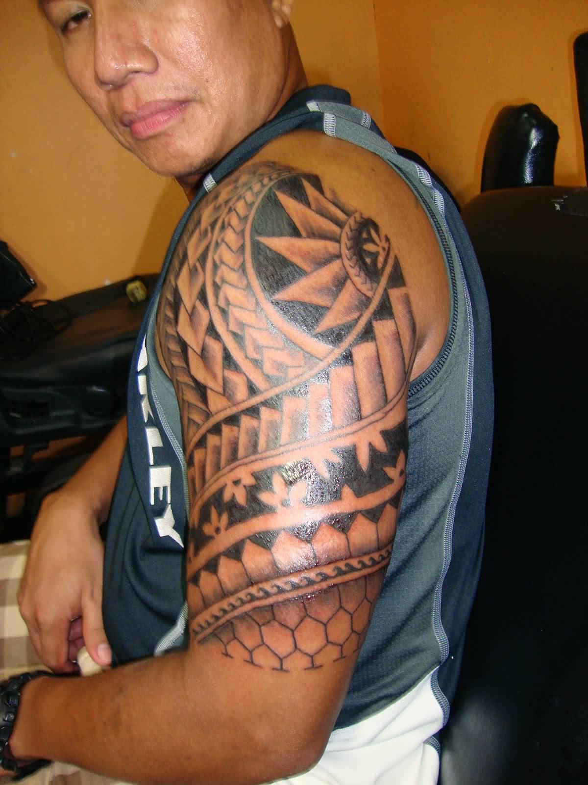 Filipino Tribal Tattoo On Man Left Sleeve