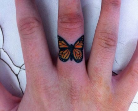 Finger Small Monarch Butterfly Tattoo