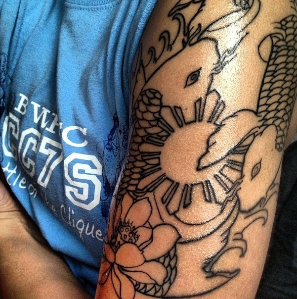 Flower And Filipino Tattoo On Left Half Sleeve