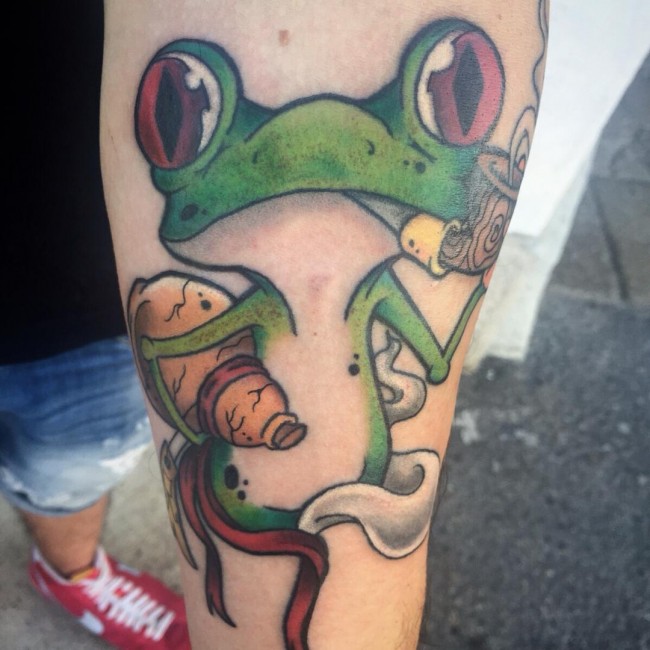 Funny Frog Smoking Pipe Tattoo On Forearm