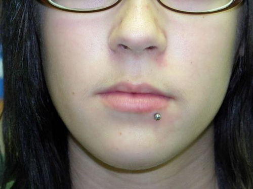 Girl With Side Labret Piercing On Lower Lip