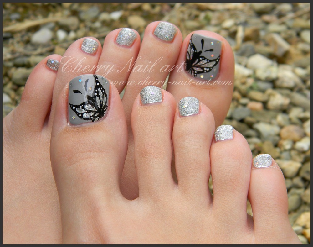 Gray Toe Nails With Black Butterfly Design Nail Art