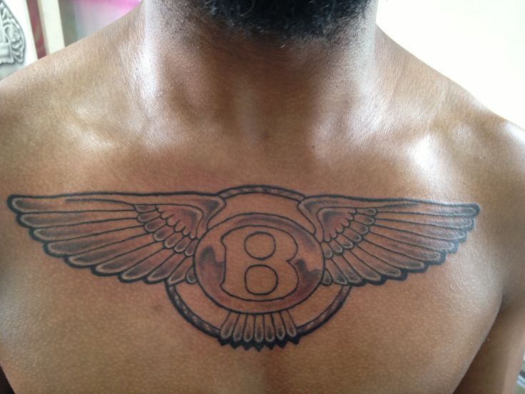 Grey Ink Bentley Symbol Tattoo On Man Chest