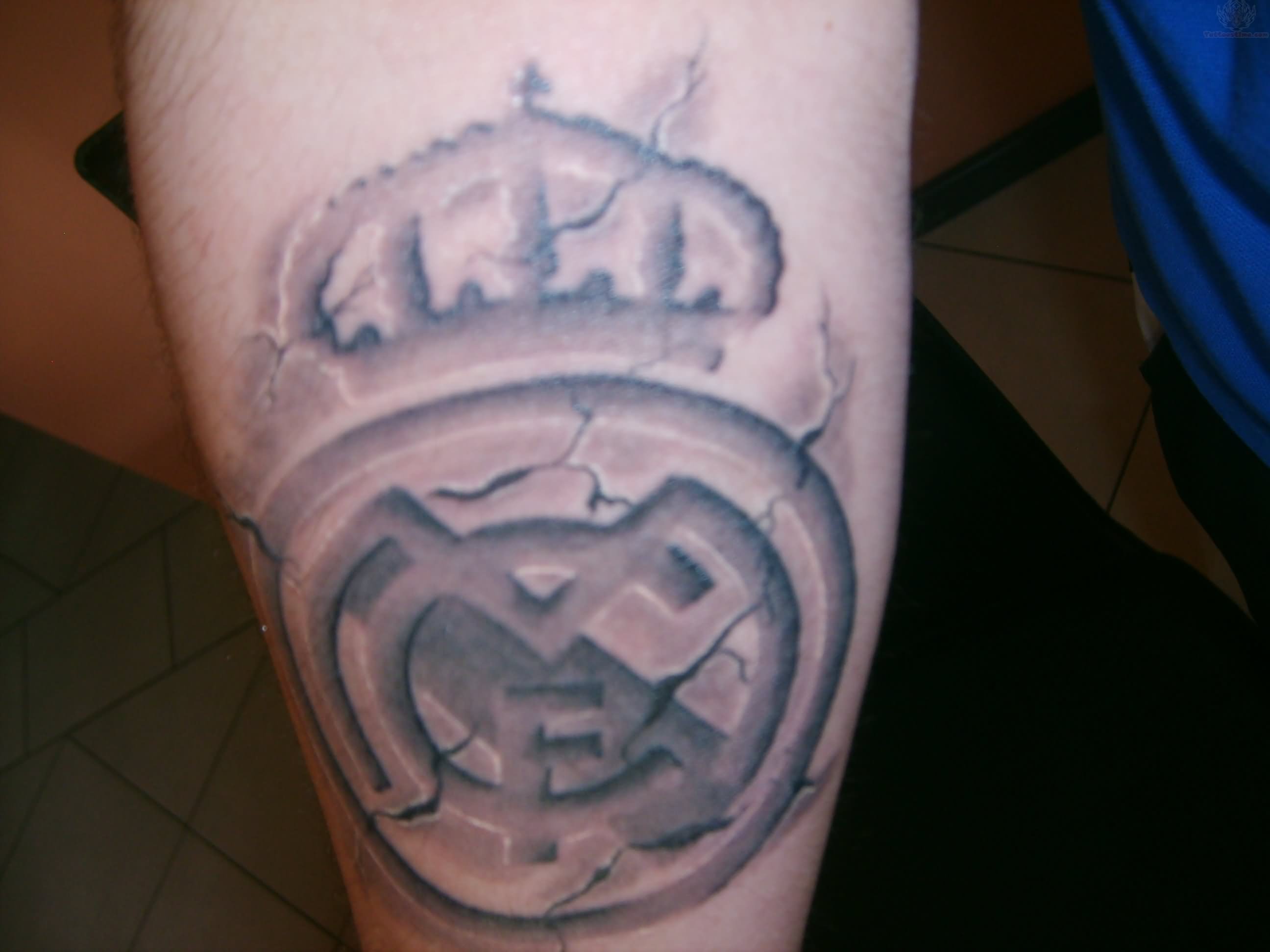 Grey Ink Real Madrid With Crown Logo Tattoo