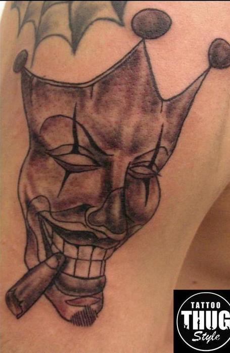 Grey Thug Mask Smoking Cigar Tattoo On Biceps