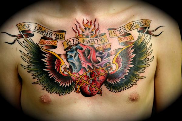 Impressive Heart On Fire Tattoo On Chest For Men