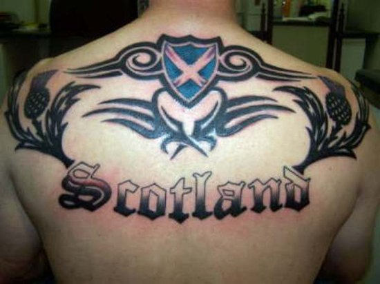 Impressive Scottish Tribal Tattoo On Upper Back