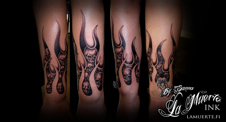 Impressive Skulls And Flame Tattoo On Wrist