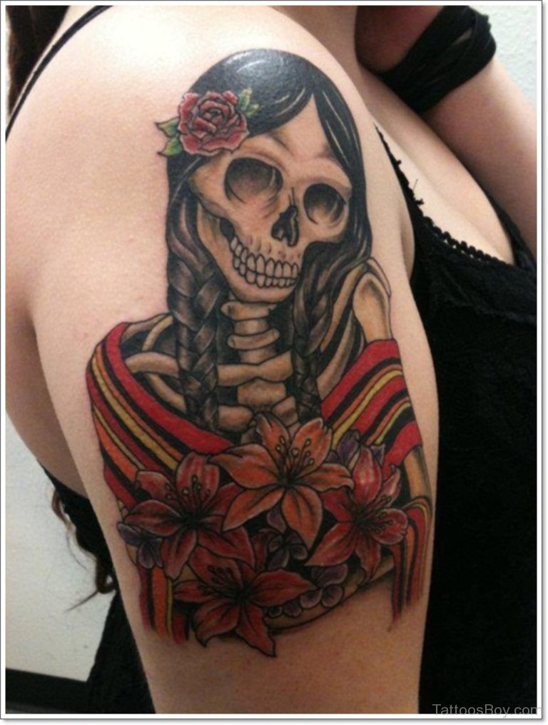 Latino And Flower Tattoo On Right Shoulder