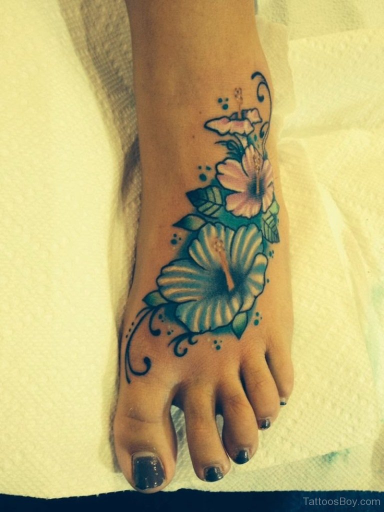 Lovely Hibiscus Flowers Tattoo On Girl Foot