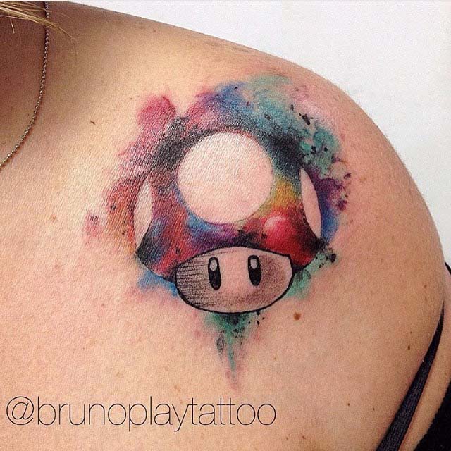Mario Mushroom Watercolor Tattoo On Upper Shoulder