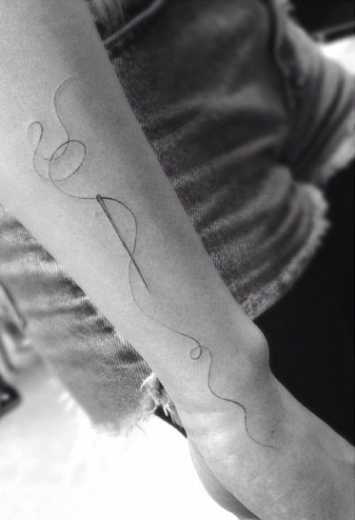 Nice Sewing Needle Tattoo On Arm Sleeve