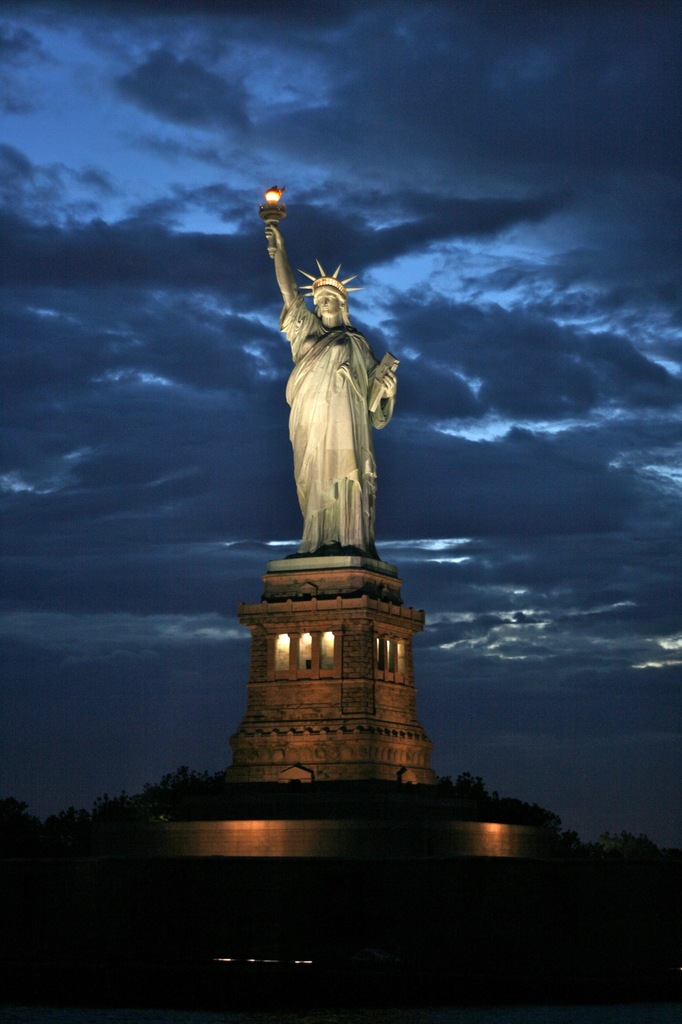 Night View Of Statue Of Liberty In New York